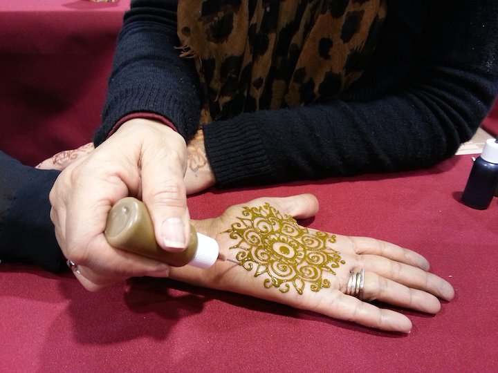 Artist Applying Henna Tattoo on Women Hand. Mehndi Stock Video Footage -  Alamy